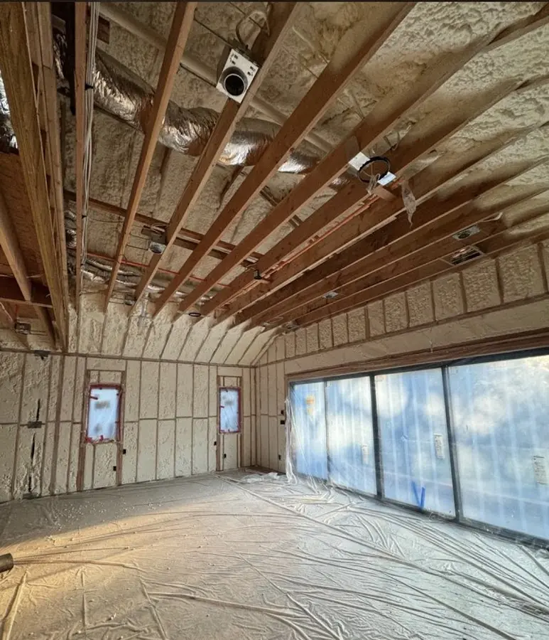 Interior walls and ceiling insulated with spray foam during new construction in Asbury